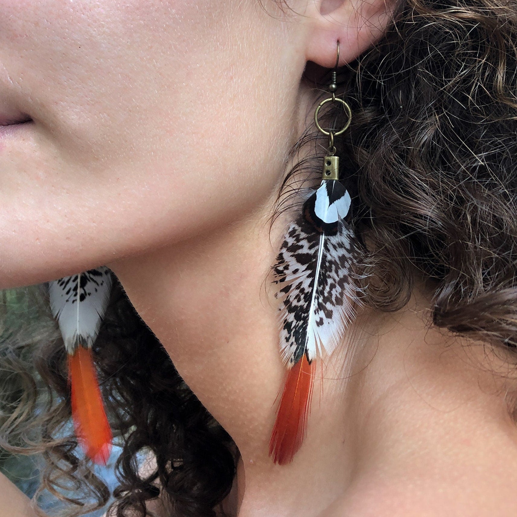 Red tip feather earrings