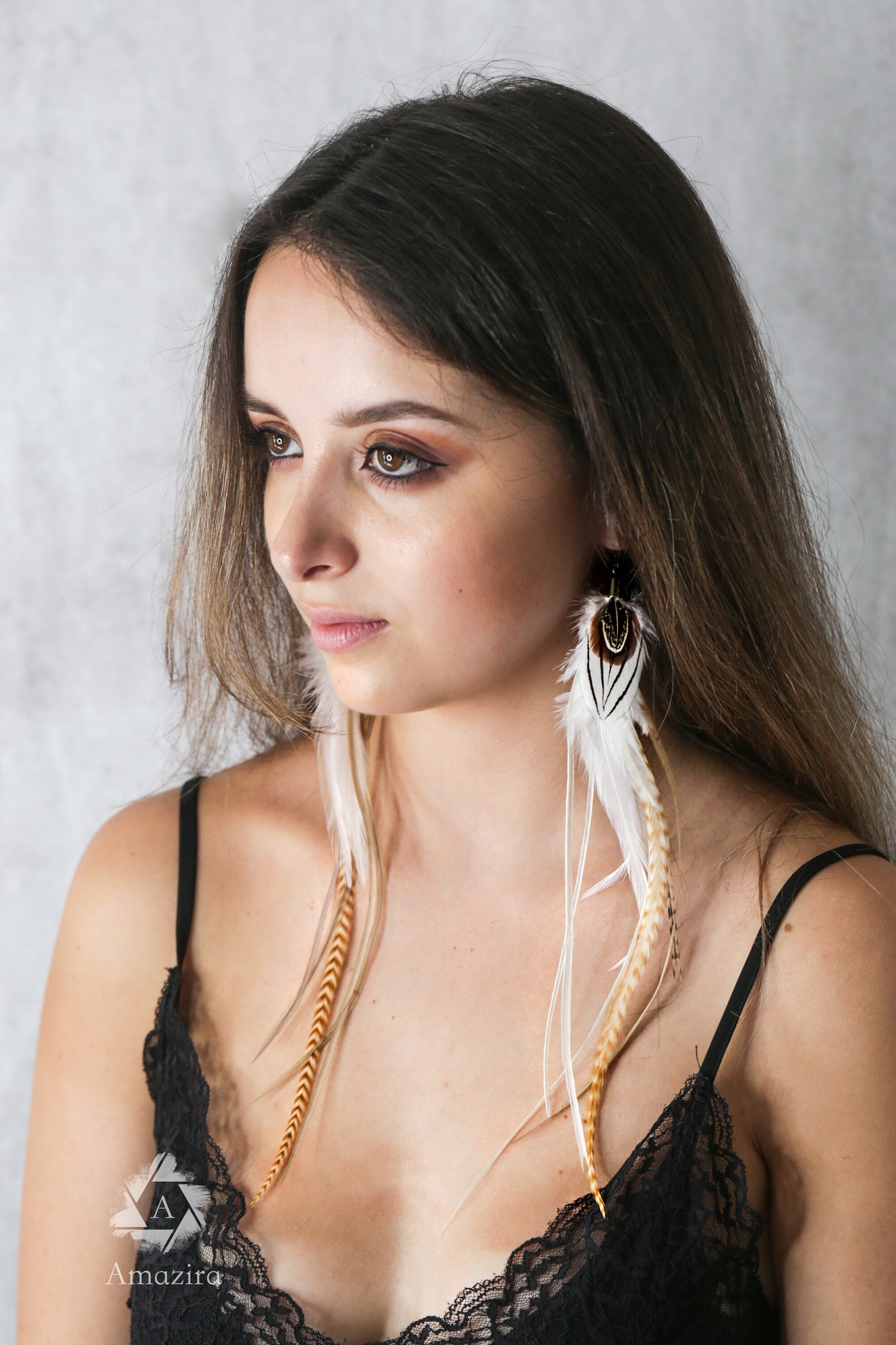 Extra long white feather grizzly earrings