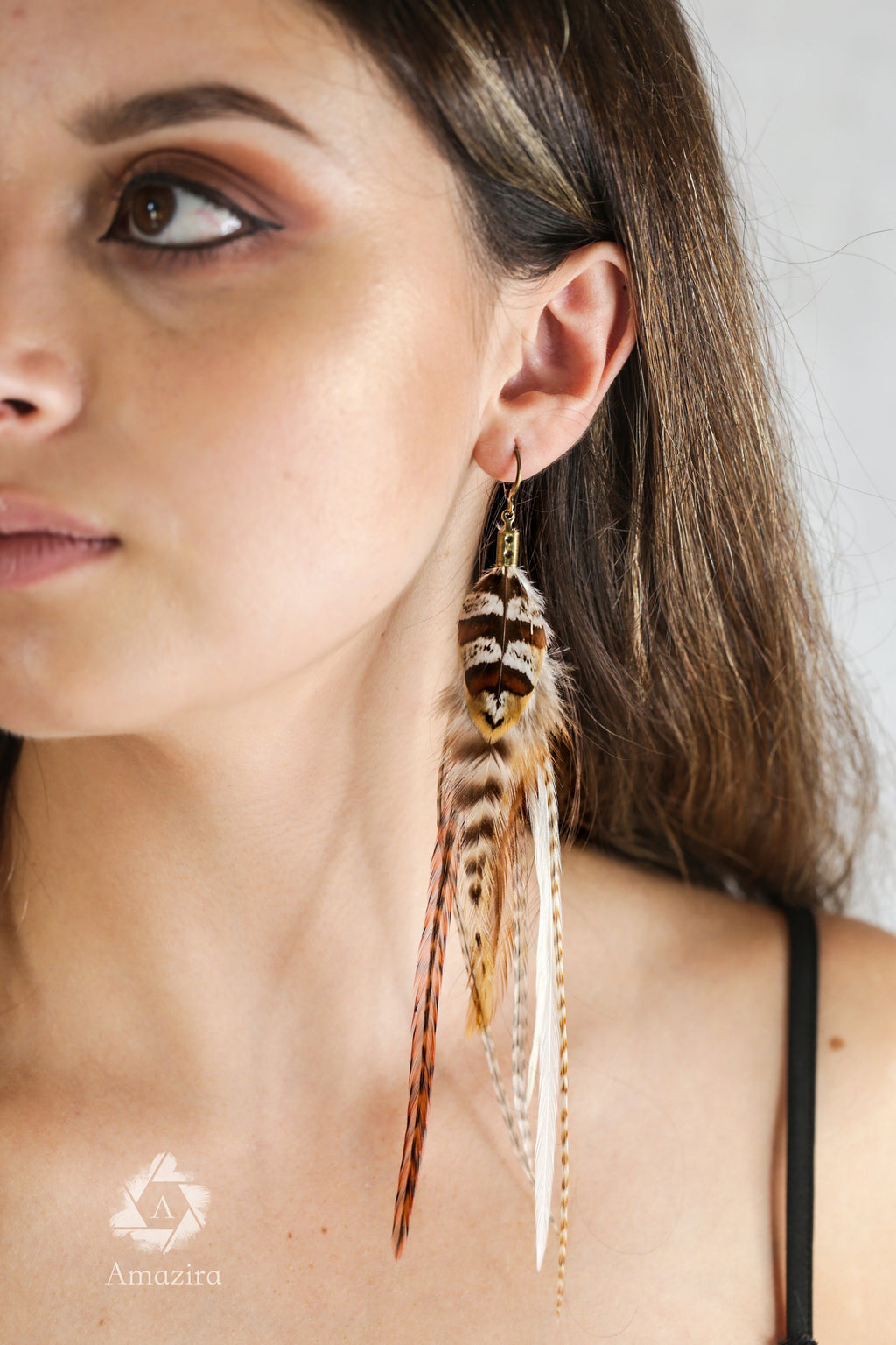 Long natural striped real feather grizzly earring