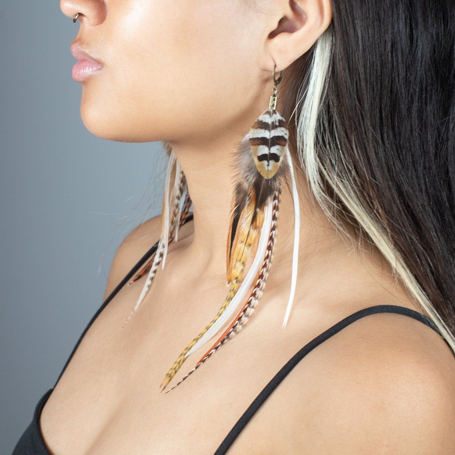 Long natural striped real feather grizzly earring