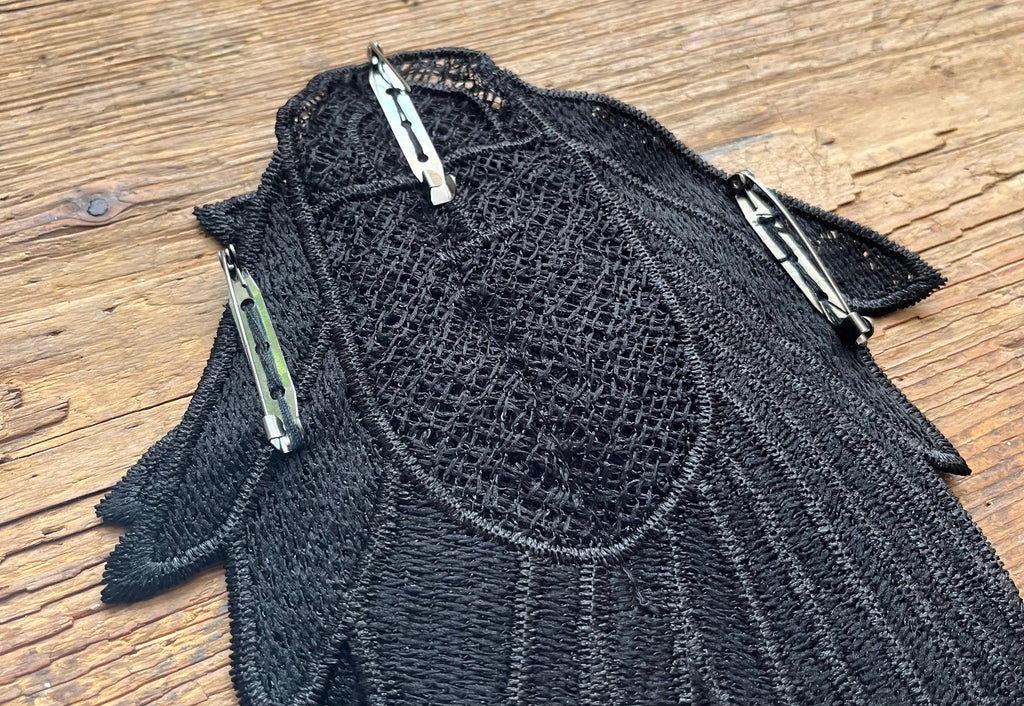 Black feather shawl, shoulder pad